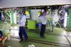 Engineers working on underfloor wiring