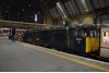 Caledonian Sleeper 86401 Mons Meg stands at London King's Cross on January 18, with the empty coaching stock from Wembley that forms the 2106 Highland Sleeper to Aberdeen/Fort William/Inverness.