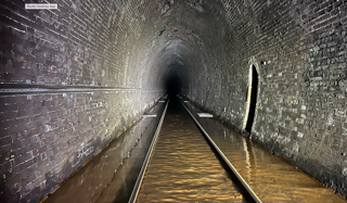 Flooding inside Bransty Tunnel near Whitehaven on the Cumbrian Coast Line. NETWORK RAIL.