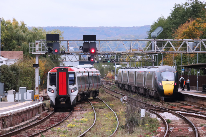 Transport for Wales 197107 and Great Western Railway 800013 pass each other at Gloucester station. RICHARD ALLEN.