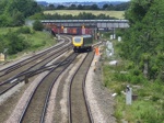 Northern Trains 195023 sits on the crossover with an oncoming Freightliner Class 66 at a red signal in the background at Clay Cross Junction. ANDREW LISZKA.