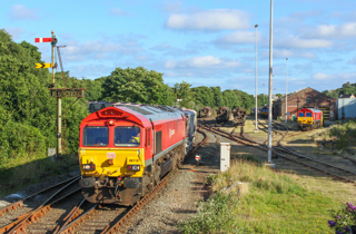 A busy scene at St Blazey on the evening of July 15 2020. DB Cargo 66118 heads for Goonbarrow with CDA empties while 66107 stands in the background with the weedsprayer MPV. 66100 can also be seen having worked from Par Harbour earlier in the day. CRAIG MUNDAY.