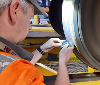 Peter Wright, a service assistant for Arriva TrainCare, puts his newly learned skills to use, carrying out maintenance on CrossCountry’s Voyager fleet at Tyne Depot. ANDY COMFORT.