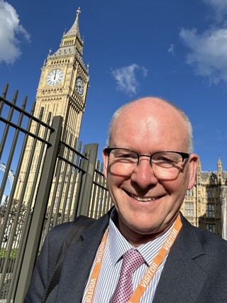 Chris Gibb in front of Parliament