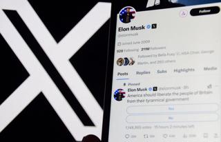 Mobile phone screen showing Elon Musk's post about UK government on X against a logo background. ALAMY