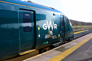 A side-on view of GWR 802101 showing its 'Enhanced WiFi' sign on the site. STEVE WIDDOWSON.