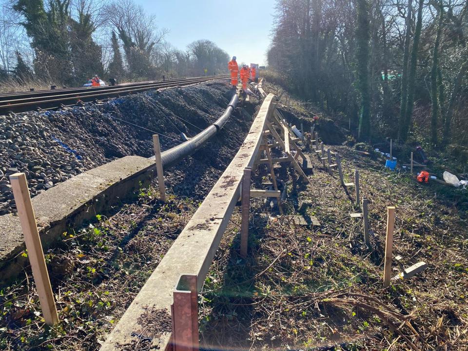 Network Rail is focusing more on maintenance rather than renewals, with the effects of severe weather becoming an increasing problem. In January, NR engineers work to repair a landslip at Tinsley Green on the Brighton Main Line. NETWORK RAIL.