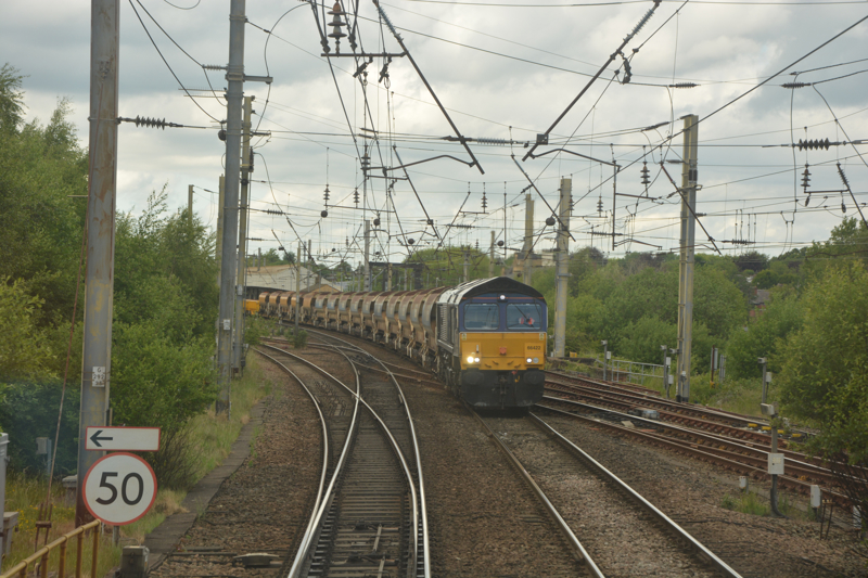 Passing Direct Rail Services 66422 (with the 1231 Carlisle North Yard to Basford Hall Yard engineering train), on the approach to Warrington Bank Quay. DAVID STUBBINGS.