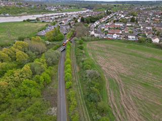 DB cargo 66655 with a Margam to Portbury empty steel train passing the junction to Portishead, on the edge of Pill village. GARY ESSEX.
