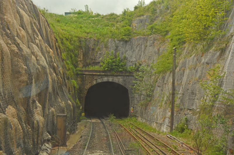 Entering Dove Holes Tunnel on the freight-only Great Rocks Line, which serves numerous quarries near Buxton. DAVID STUBBINGS.