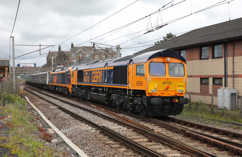 GB Railfreight 66313 Lucie and 99001 pass Carnforth with a test run on June 25, running as the 1001 Carlisle Kingmoor Sidings to Crewe. PHIL METCALFE.