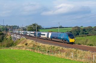 Avanti West Coast 390118 passes Docker on October 5 2024, with the 0707 Birmingham New Street to Glasgow Central. Improved frequencies and faster speeds following electrification attracted more business to the West Coast Main Line. TOM MCATEE.