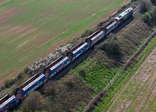The final rake of O&K hopper wagons leaves Merehead on April 3. TOTAL COMMERCIAL PHOTOGRAPHY.