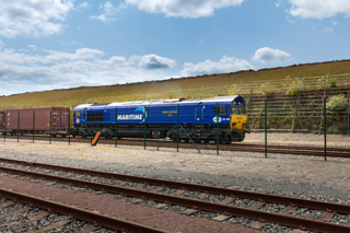 Maritime Intermodal Six, operated by DB Cargo 66090, exits the Northampton Gateway Strategic Rail Freight Interchange on June 16. MARITIME TRANSPORT.