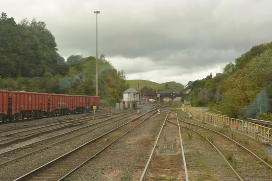 The view from Peak Forest Long Sidings as we start the 1-in-90 climb up towards the summit by Cemex’s yard under the bridge. The former Midland Railway Peak Forest South signal box can be seen in the centre. DAVID STUBBINGS.
