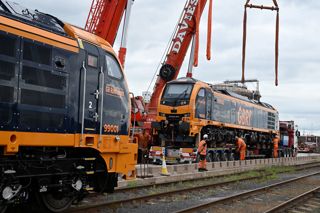 GBRf's 99002 is lowered onto rails at Bristol Port on June 10, 99001 is already on land. GB RAILFREIGHT.