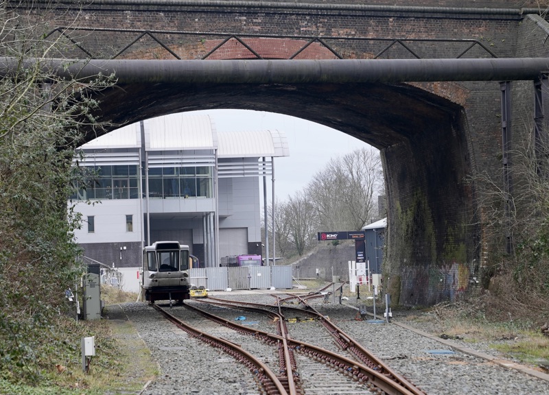 Looking through the old railway bridge at Very Light Rail National Innovation Centre building in Dudley. Parry People Mover's Railcar 10 is seen stored under the bridge. PETER PLISNER.