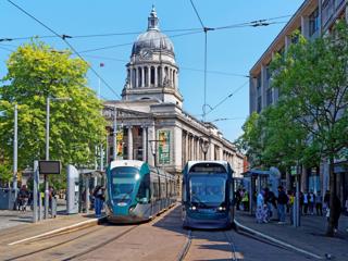 Around 30% of Nottingham Express Transit passengers travel by tram rather than use their cars because of the comfort and reliability, says Wolmar. Nottingham trams run along the city’s South Parade on June 12 2023. ALAMY.