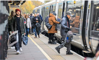 Passengers board a Chiltern Railways service bound for Birmingham Moor Street at Solihull on December 3. 2021.